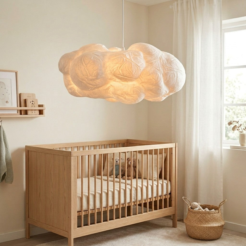 Cloud Pendant Light above a wooden cot in a Scandinavian nursery