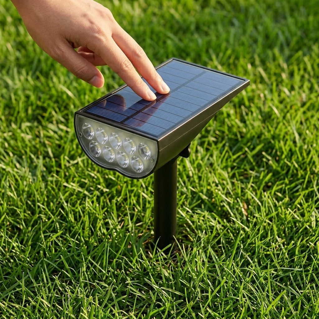 Solar garden spotlight solar panel and LED head close-up