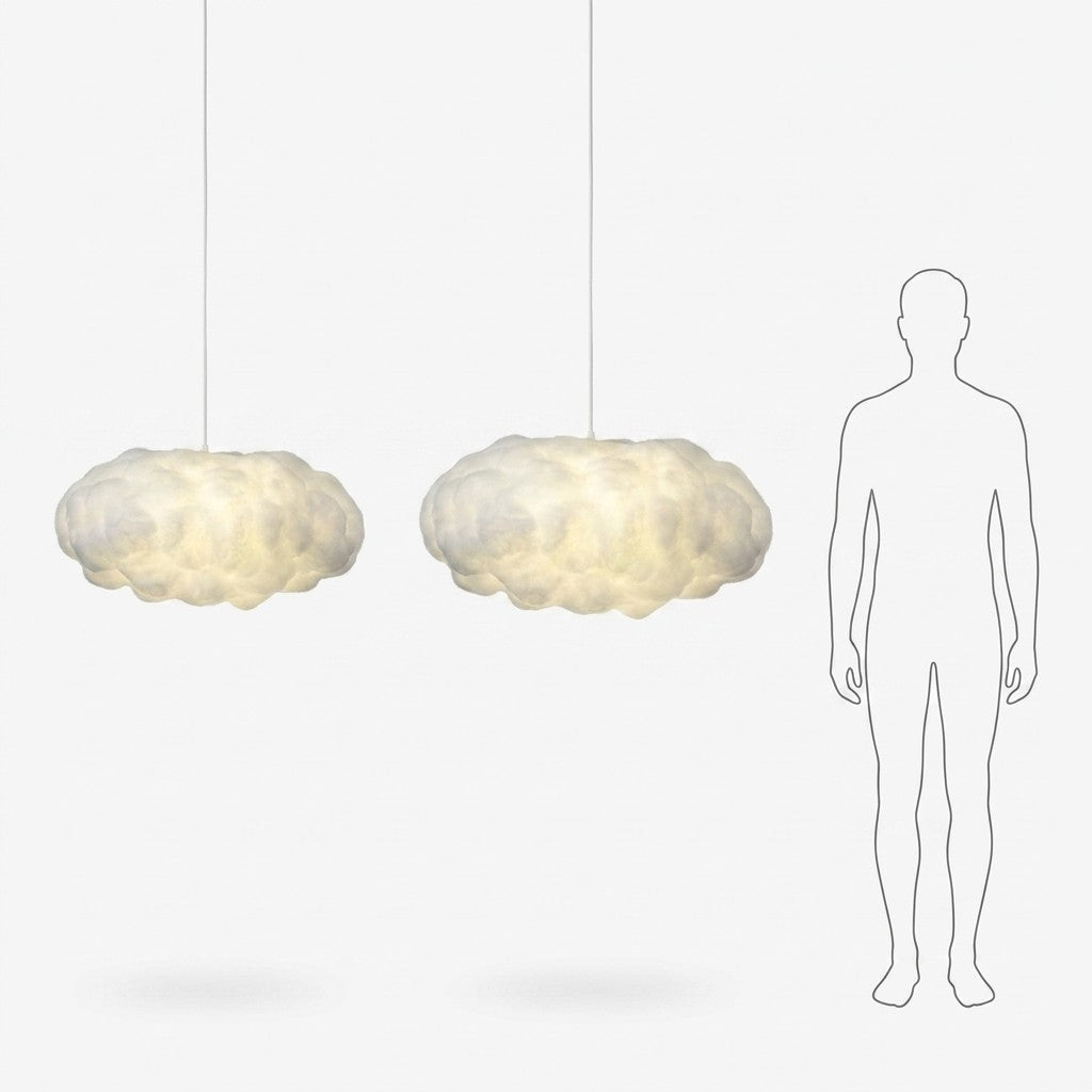 Two Cloud Pendant Lights with an adult height silhouette for scale