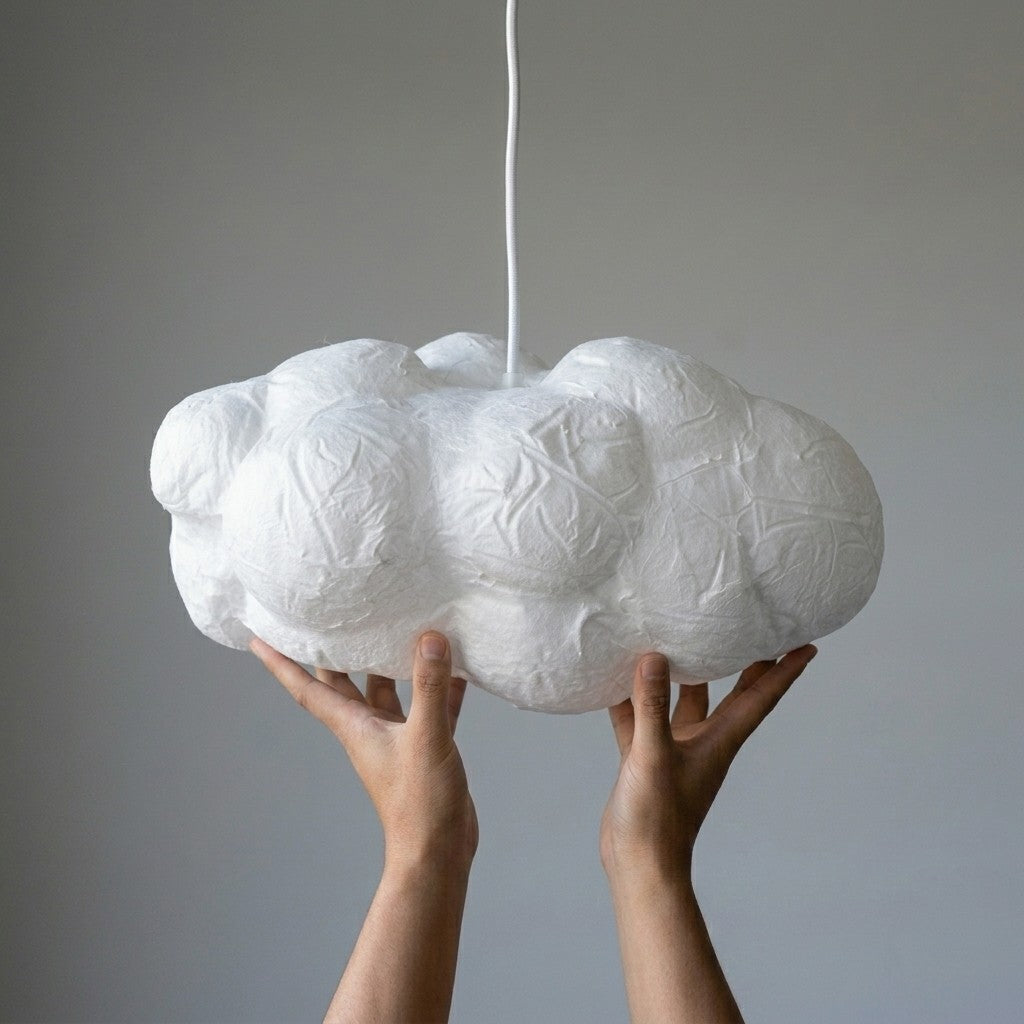 Hands holding the 40cm handcrafted cotton Cloud Pendant Light