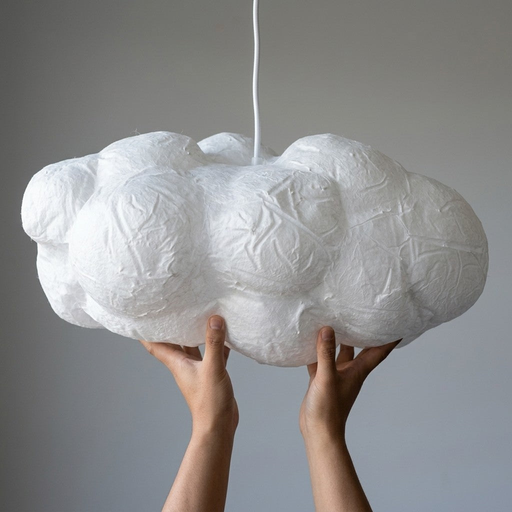 Hands holding the 50cm handcrafted cotton Cloud Pendant Light