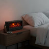 Flame diffuser on bedroom nightstand for relaxation