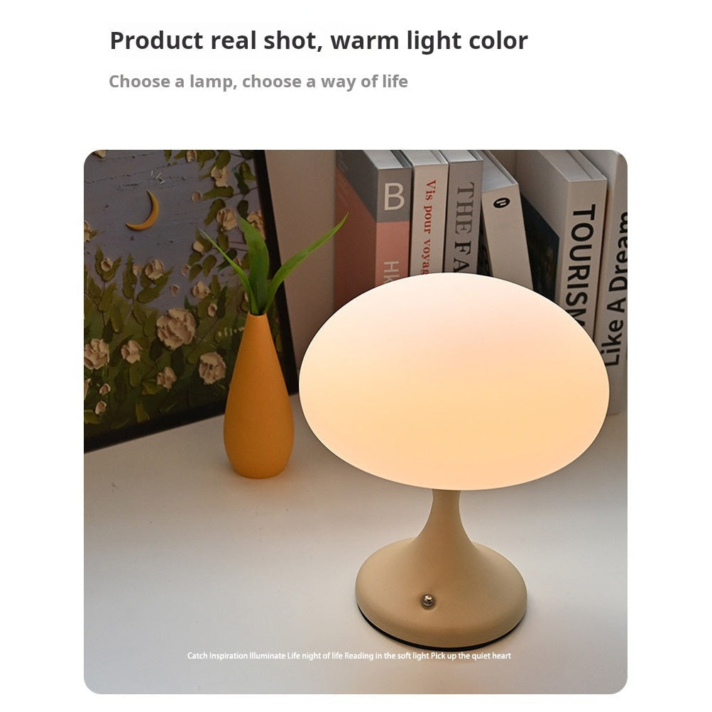 Jellyfish table lamp on desk with books - cozy workspace lighting
