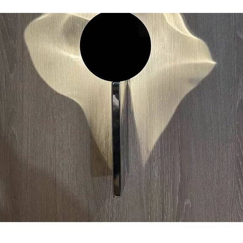Wave LED wall lamp light pattern on wood wall - modern wall sconce