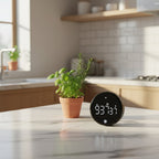Black rotary countdown timer on modern kitchen countertop