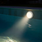 12V LED pool light installed in luxury swimming pool at night