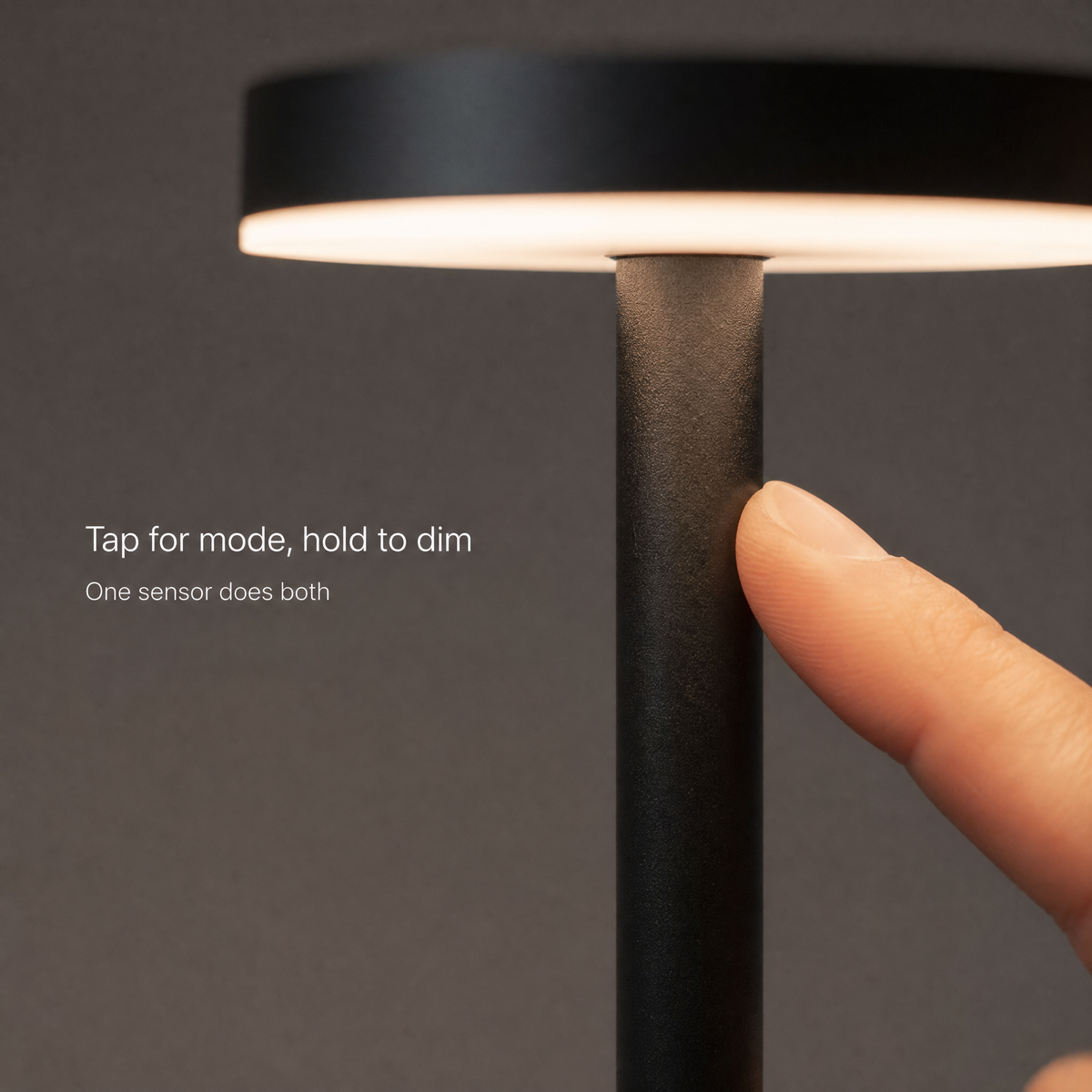 Close view of the touch sensor on the lamp's stem - tap for mode, hold to dim