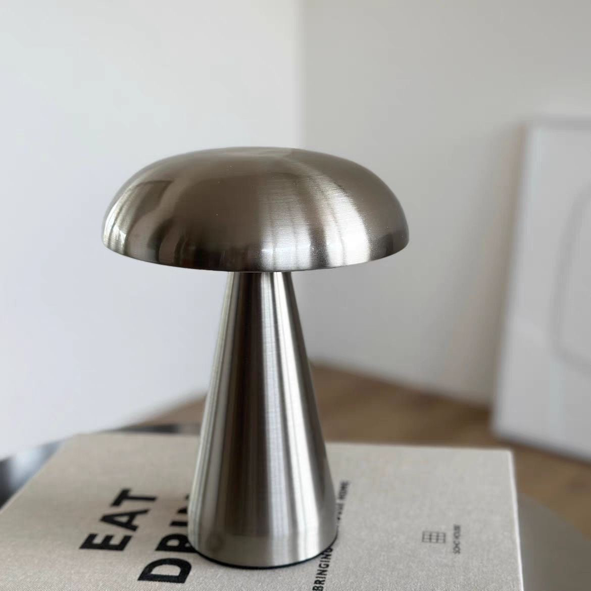 mushroom table lamp silver lifestyle - minimalist book setting