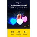 LED heart keychain lights three glow colours on backpack