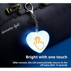 LED heart keychain light touch activation demo on handbag