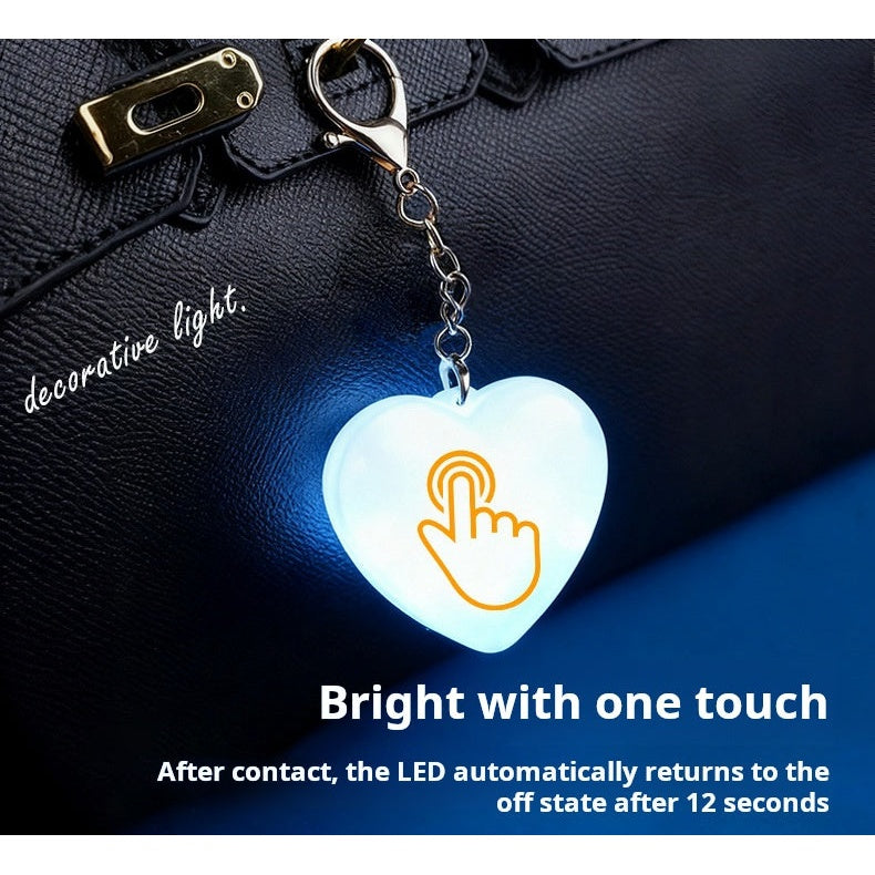 LED heart keychain light touch activation demo on handbag